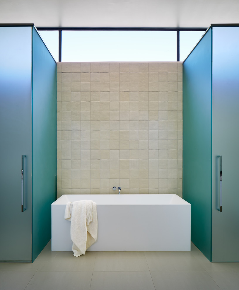 Inspiration for a mid-sized contemporary master bathroom in Dallas with a freestanding tub, multi-coloured walls, beige tile, ceramic tile, concrete floors and beige floor.