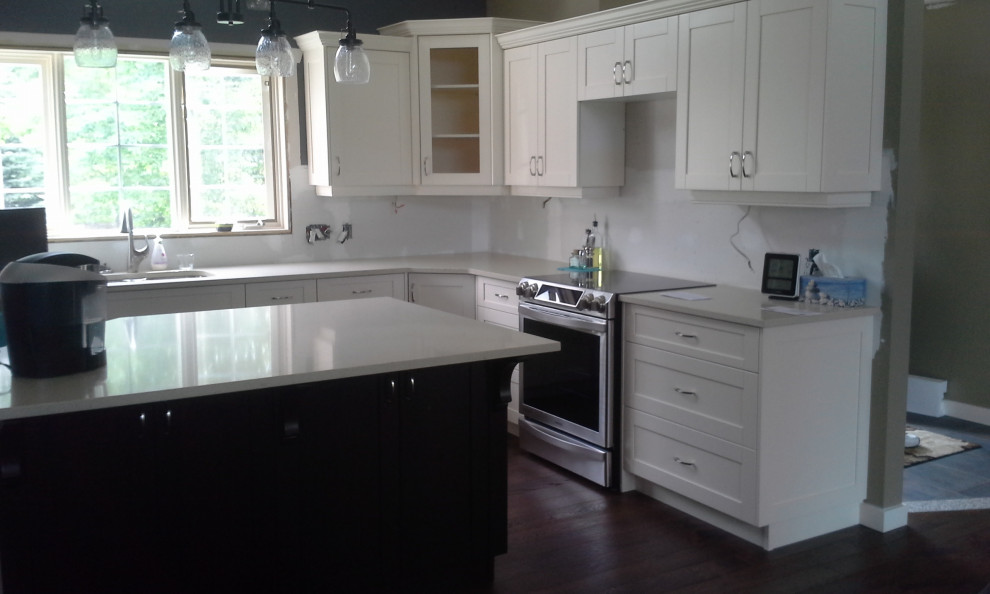 Example of a transitional kitchen design in Calgary