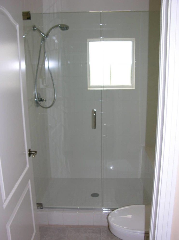 Example of a transitional 3/4 beige tile and ceramic tile ceramic tile and beige floor alcove shower design with beige walls and a hinged shower door