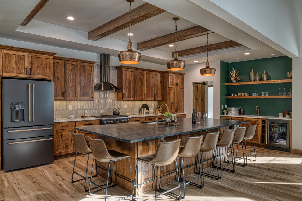 Open concept kitchen - large transitional l-shaped vinyl floor, beige floor and tray ceiling open concept kitchen idea with an undermount sink, shaker cabinets, medium tone wood cabinets, quartz countertops, beige backsplash, ceramic backsplash, stainless steel appliances, an island and multicolored countertops