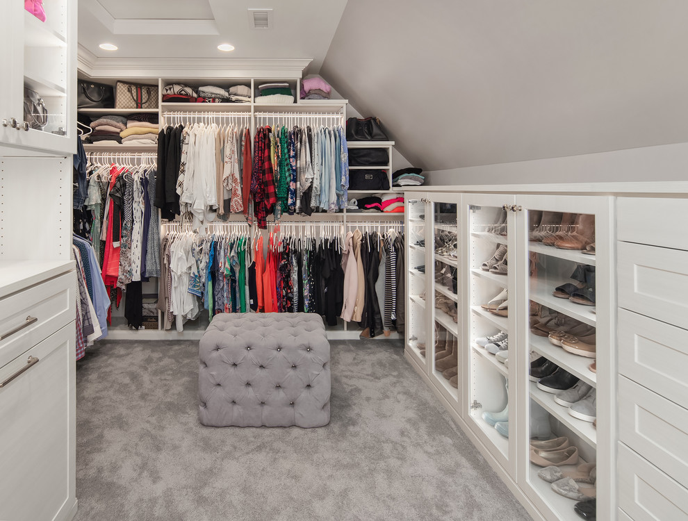 Inspiration for a traditional women's storage and wardrobe in Seattle with glass-front cabinets, white cabinets, carpet and grey floor.