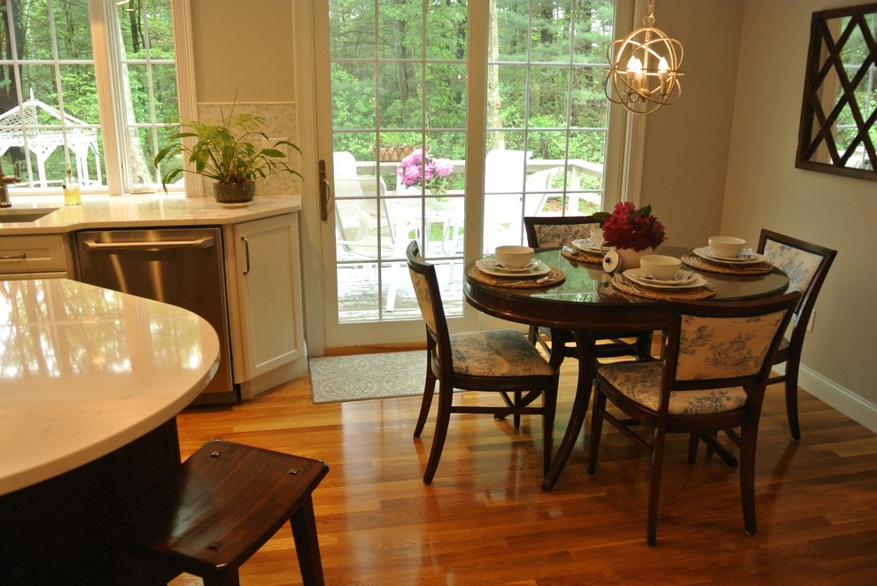Inspiration for a transitional medium tone wood floor eat-in kitchen remodel in Boston with an undermount sink, shaker cabinets, quartz countertops, beige backsplash, mosaic tile backsplash, stainless steel appliances, an island and white countertops