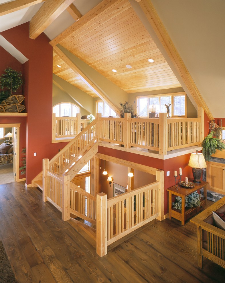 Photo of a large arts and crafts wood straight staircase in Calgary with open risers.
