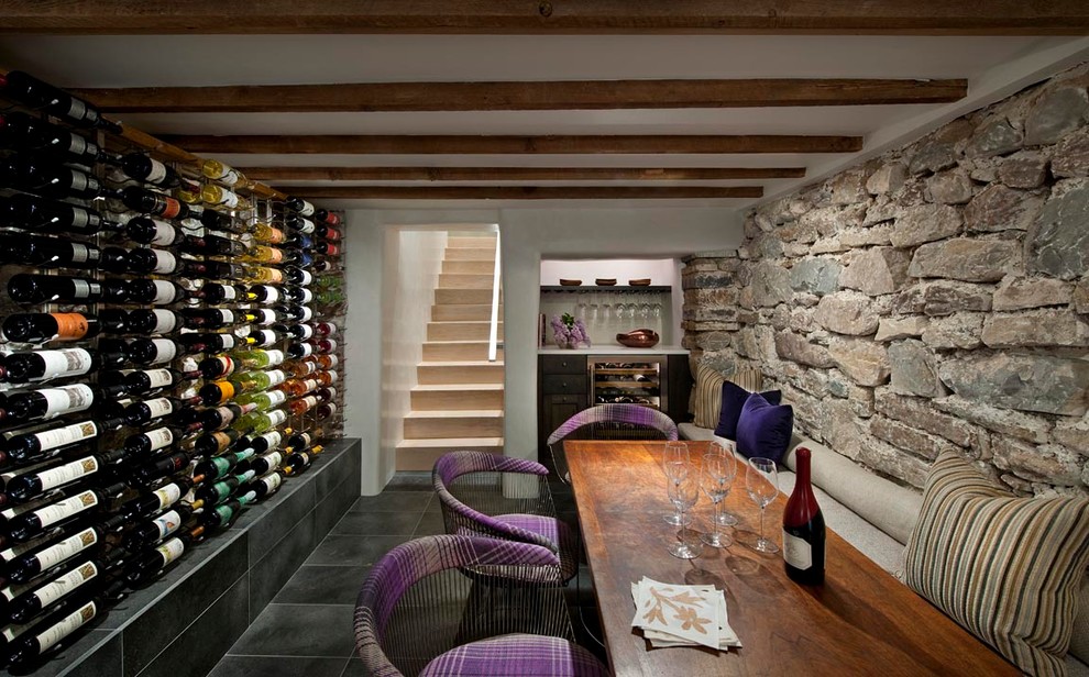 Design ideas for a wine cellar in Albuquerque with display racks, slate floors and black floor.
