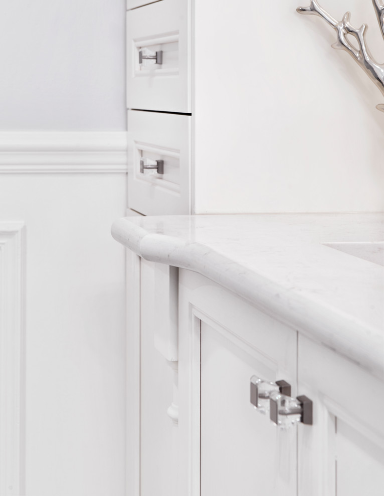 Example of a large transitional master white floor freestanding bathtub design in Ottawa with white cabinets, a two-piece toilet, white walls, an undermount sink and a hinged shower door