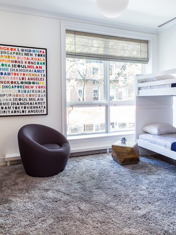 Photo of a modern kids' bedroom for boys in New York with grey walls and carpet.