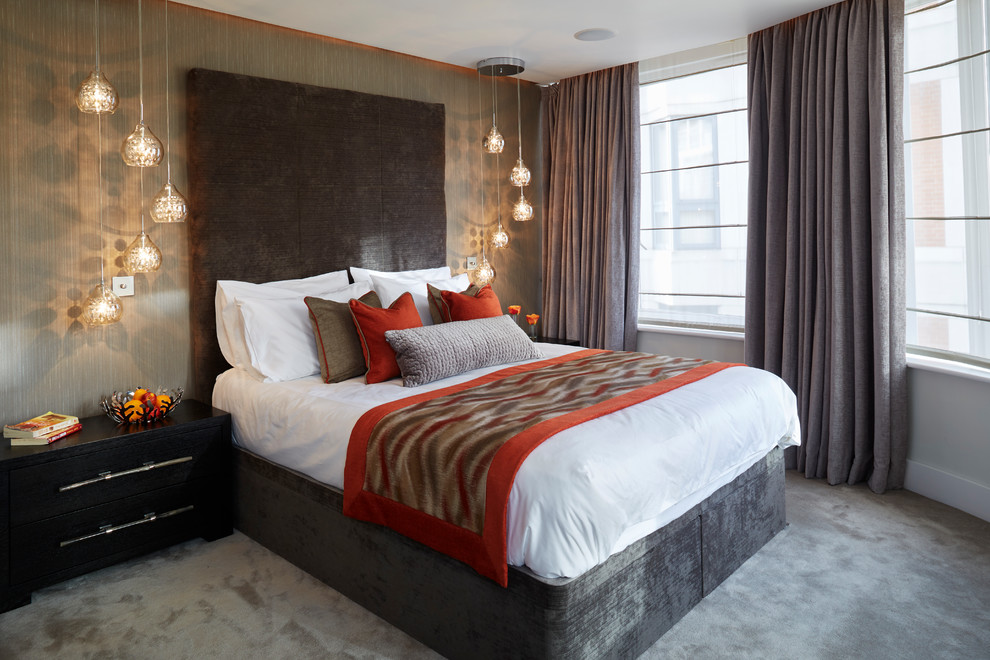 Design ideas for a contemporary guest bedroom in London with grey walls, carpet, no fireplace and grey floor.