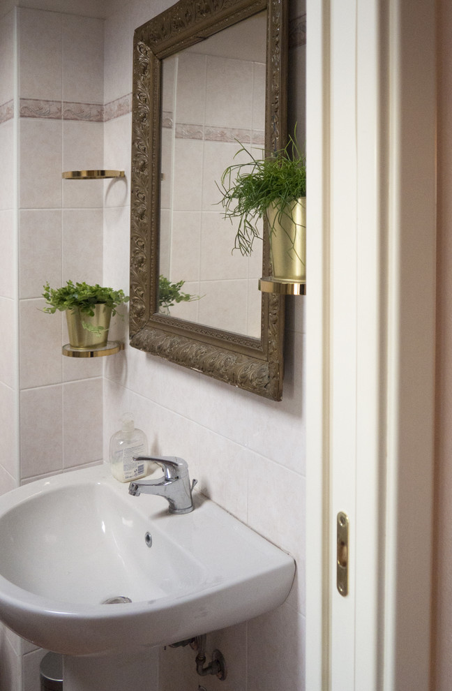 Inspiration for a small scandinavian 3/4 bathroom in Bologna with a corner shower, a two-piece toilet, white tile, ceramic tile, white walls, ceramic floors, a pedestal sink, white floor and a sliding shower screen.