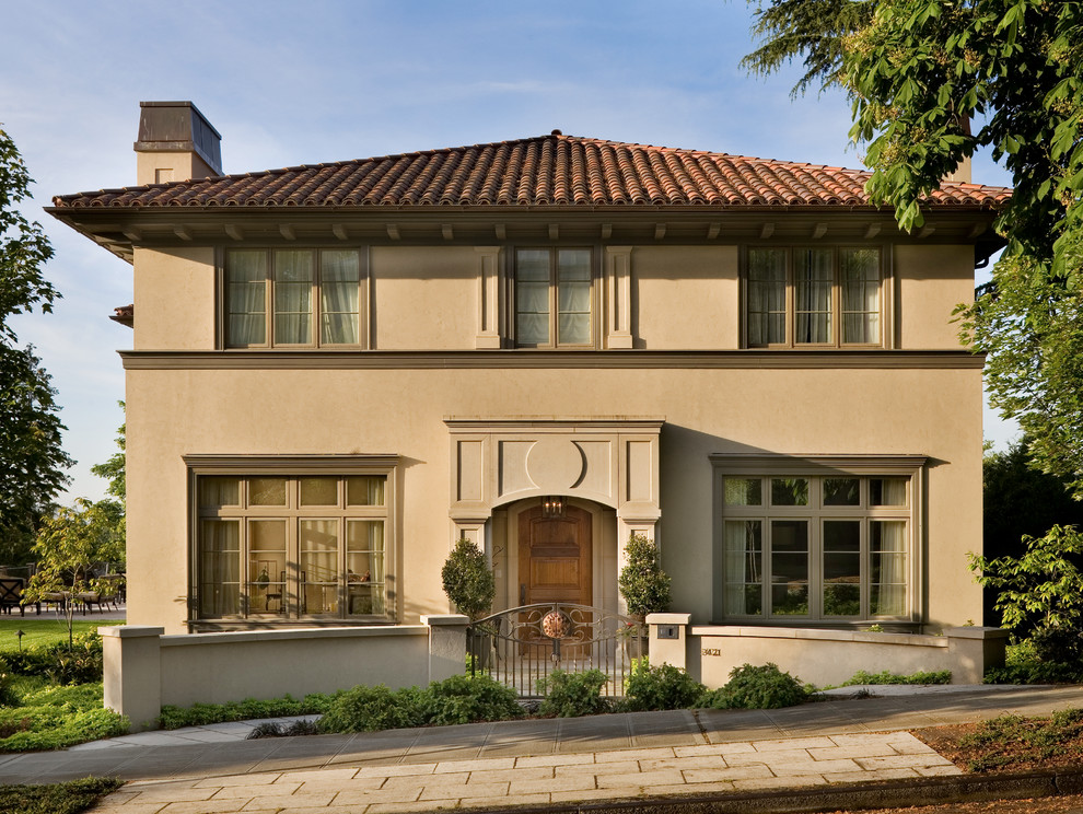 Photo of a traditional stucco exterior in Seattle.