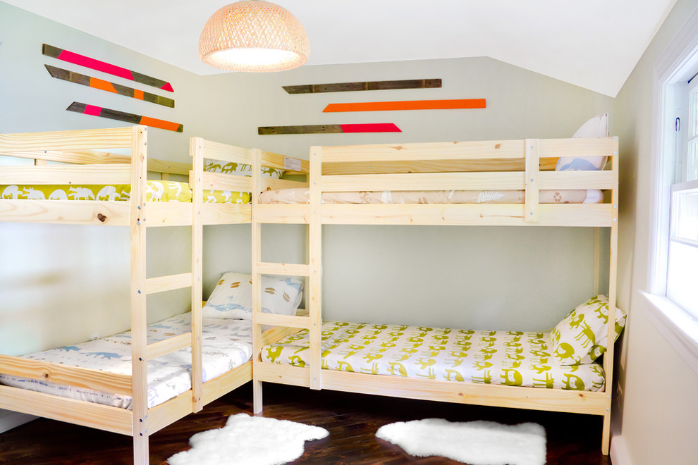 Country gender-neutral kids' bedroom in Portland Maine with grey walls and dark hardwood floors for kids 4-10 years old.