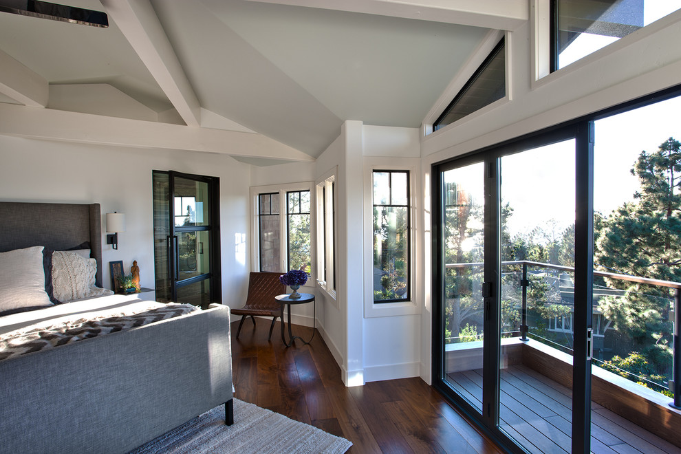 Photo of a small transitional master bedroom in San Diego with white walls, medium hardwood floors and no fireplace.
