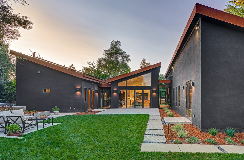 Inspiration for an expansive contemporary one-storey black house exterior in Sacramento.