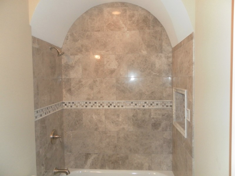 Alcove shower - transitional beige tile and mosaic tile alcove shower idea in Chicago with beige walls