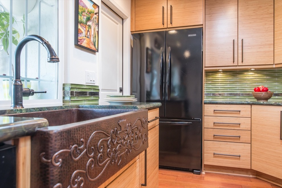 Traditional galley eat-in kitchen in San Diego with black appliances, a drop-in sink, flat-panel cabinets, light wood cabinets, granite benchtops, green splashback and subway tile splashback.