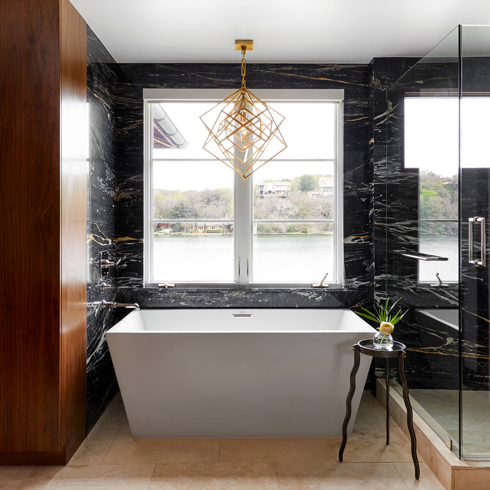 Design ideas for a mid-sized contemporary master bathroom in Austin with a freestanding tub, black tile, marble, travertine floors, beige floor, a hinged shower door, black walls and a corner shower.