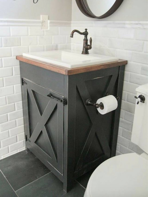 Mid-sized country 3/4 bathroom in Tampa with furniture-like cabinets, grey cabinets, a two-piece toilet, white tile, subway tile, grey walls, slate floors, a drop-in sink, wood benchtops, black floor and brown benchtops.