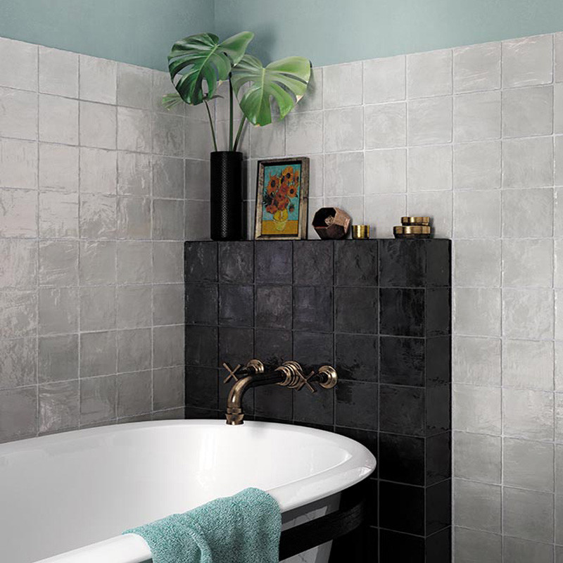 Beach style bathroom in Los Angeles with black and white tile, ceramic tile, multi-coloured walls and cement tiles.