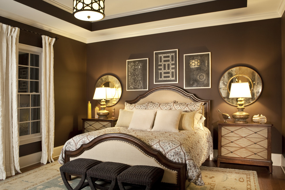 Transitional master bedroom in Charlotte with grey walls and dark hardwood floors.