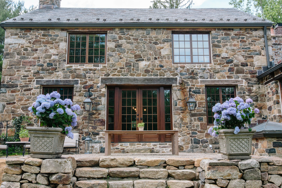 This is an example of a country exterior in New York with stone veneer.