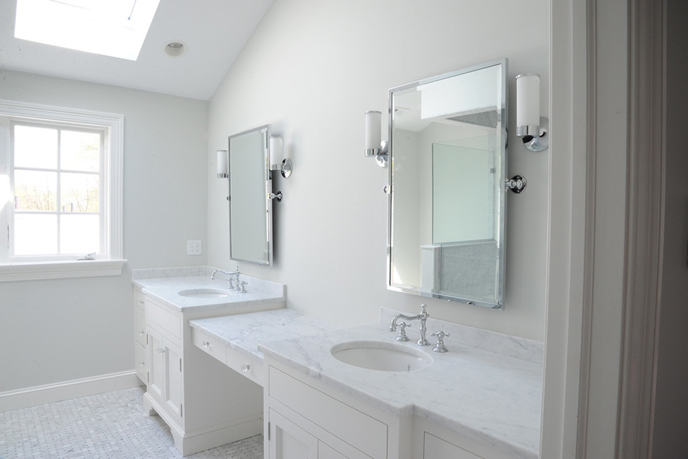 Example of a large transitional master white floor corner shower design with recessed-panel cabinets, white cabinets, white walls and an undermount sink