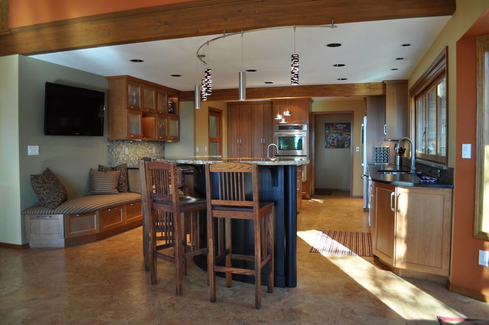 Example of a large mountain style u-shaped eat-in kitchen design in Boise with a double-bowl sink, glass-front cabinets, light wood cabinets, soapstone countertops, matchstick tile backsplash, stainless steel appliances and two islands