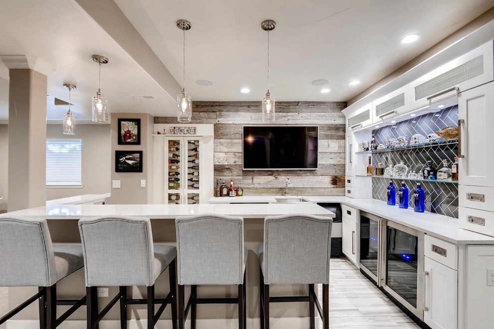 Photo of a small contemporary u-shaped wet bar in Denver with an undermount sink, shaker cabinets, white cabinets, quartz benchtops, brown splashback, timber splashback, ceramic floors, grey floor and white benchtop.