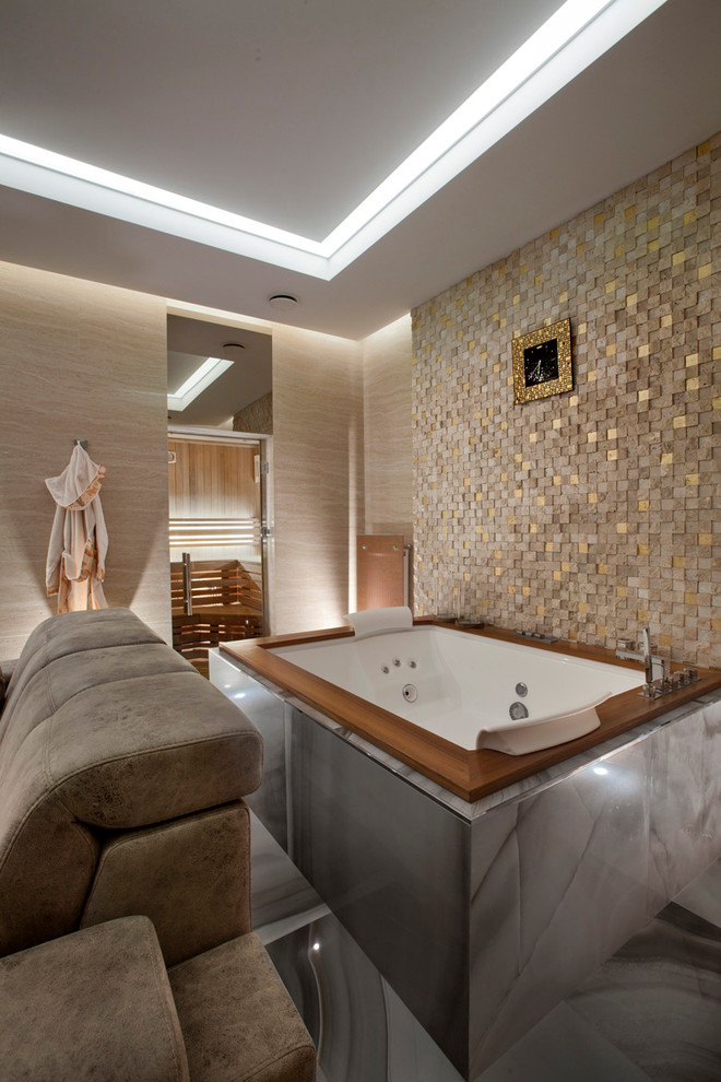 Design ideas for a contemporary master bathroom in Moscow with a hot tub and beige tile.
