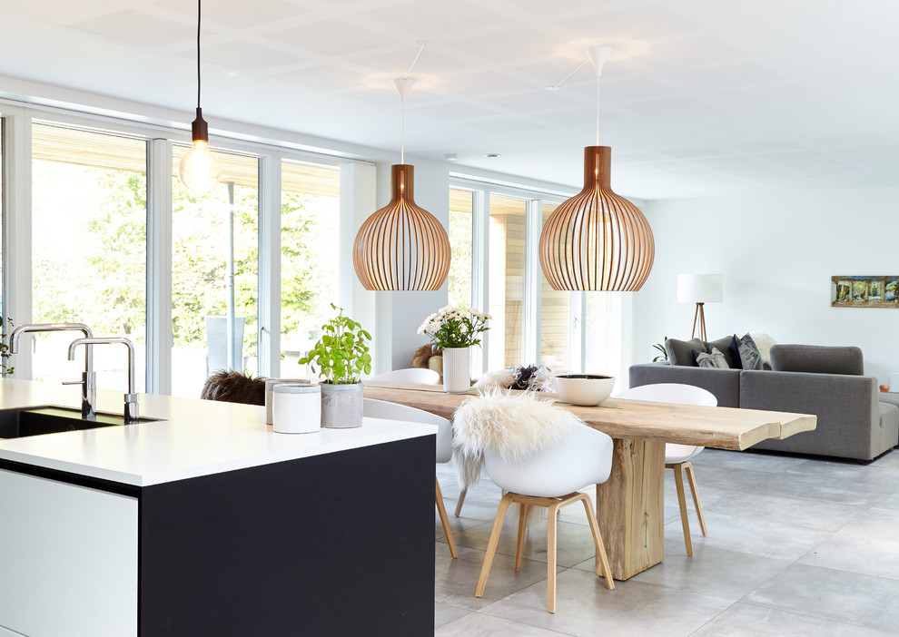 Inspiration for a large modern dining room in Aalborg with porcelain floors and grey floor.