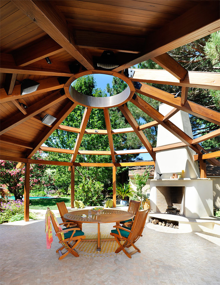 Inspiration for a contemporary patio in San Francisco with a fire feature and a gazebo/cabana.