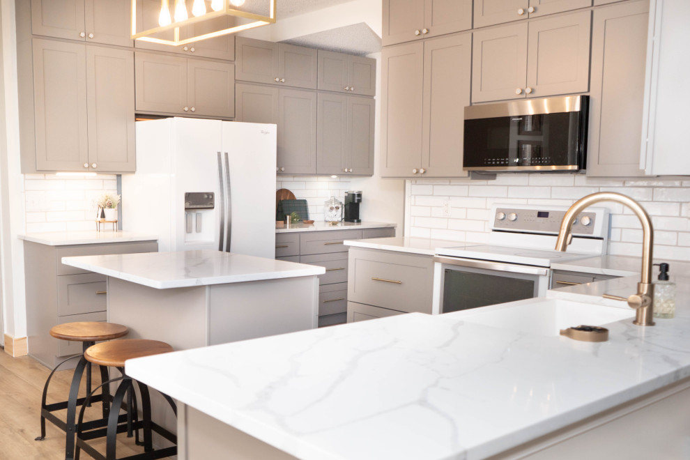 This is an example of a contemporary kitchen in Raleigh with white worktops.