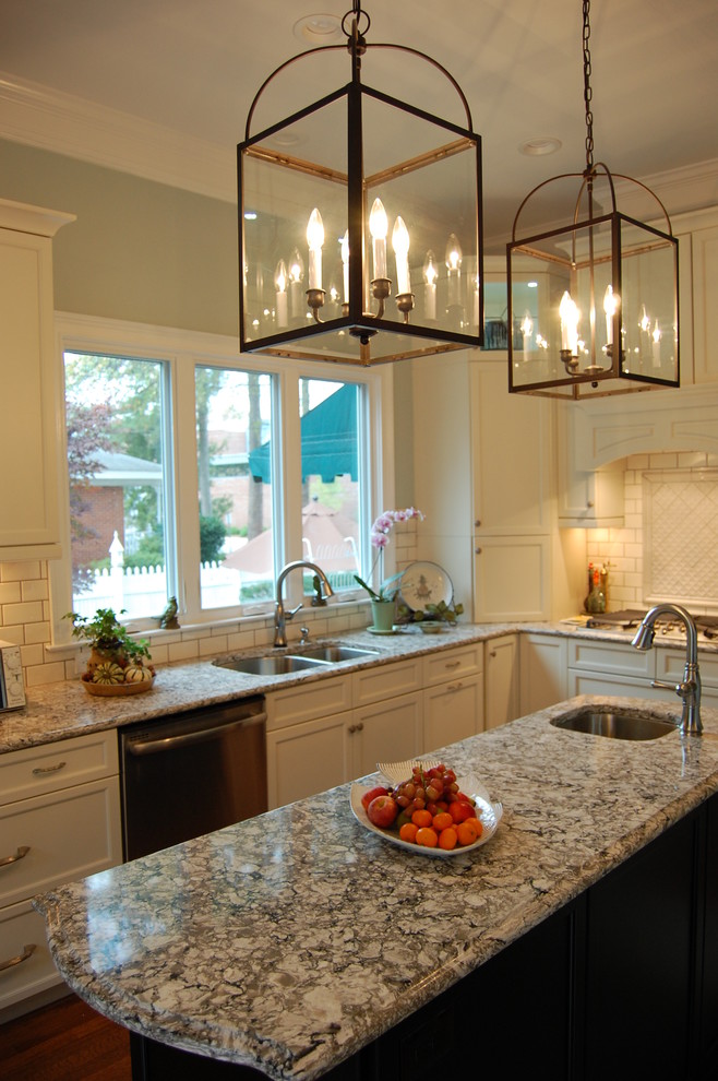 Eat-in kitchen - transitional u-shaped eat-in kitchen idea in Raleigh with an undermount sink, recessed-panel cabinets, white cabinets, quartzite countertops, white backsplash, subway tile backsplash and stainless steel appliances