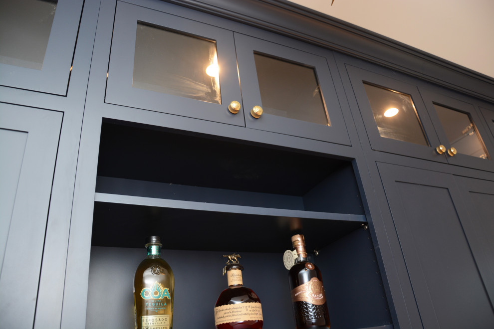 Inspiration for a small transitional single-wall wet bar in Baltimore with an undermount sink, beaded inset cabinets, blue cabinets, quartz benchtops, grey splashback, glass tile splashback and white benchtop.