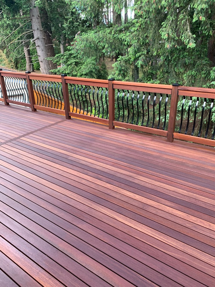 Design ideas for a large arts and crafts balcony in Seattle with wood railing.
