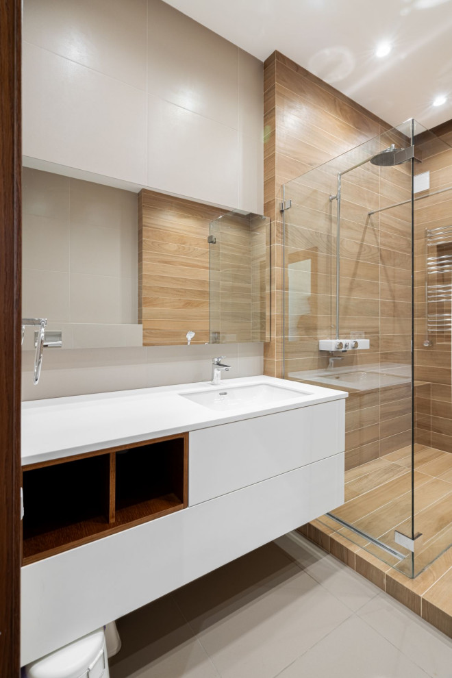 Bathroom - mid-sized contemporary kids' single-sink bathroom idea in Other with white cabinets, a two-piece toilet, white walls, solid surface countertops, a hinged shower door, white countertops and a floating vanity