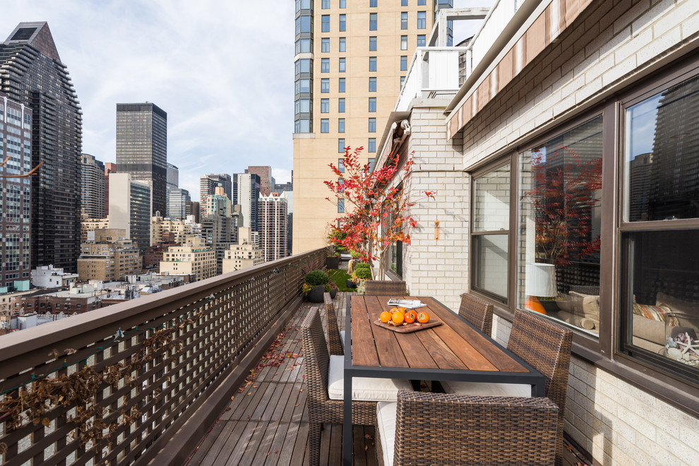 Inspiration for a transitional balcony in New York with an awning.