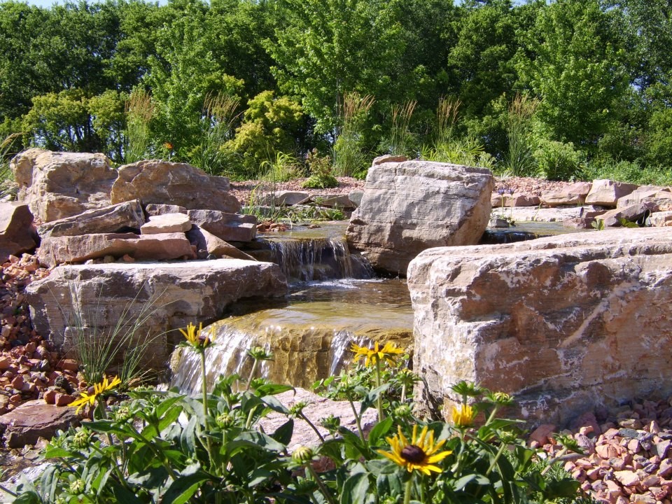 Photo of a traditional full sun backyard stone formal garden.