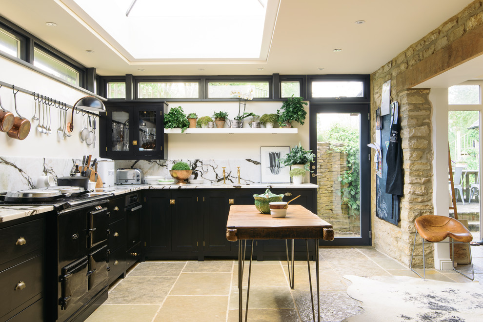 Inspiration for a mid-sized country l-shaped kitchen in Other with marble benchtops, white splashback, marble splashback, black appliances, with island, beige floor, white benchtop and shaker cabinets.