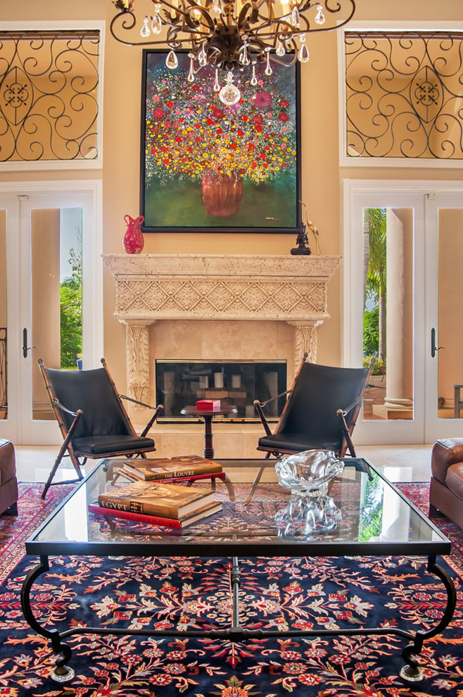 This is an example of a large traditional formal open concept living room in Miami with a standard fireplace and no tv.
