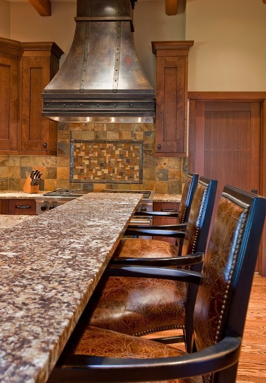 Kitchen - large rustic l-shaped medium tone wood floor kitchen idea in Seattle with granite countertops, multicolored backsplash, stainless steel appliances and an island