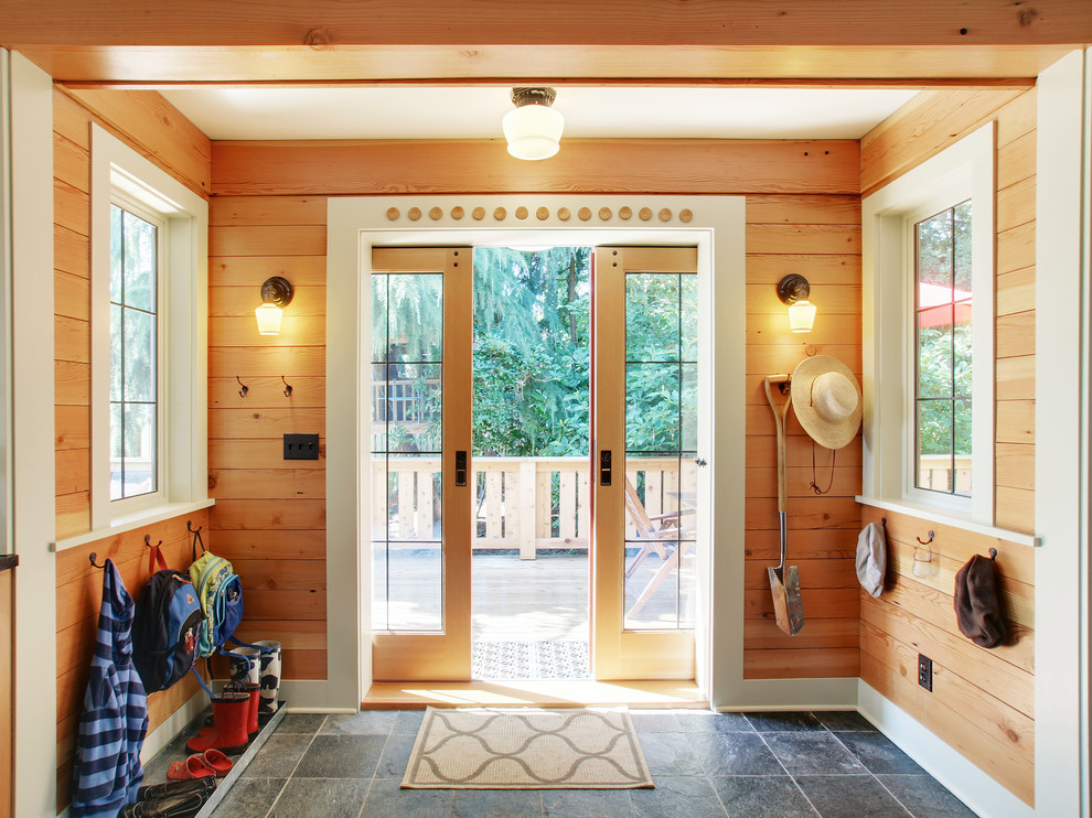 Inspiration for a rustic gray floor double front door remodel in Seattle with a glass front door