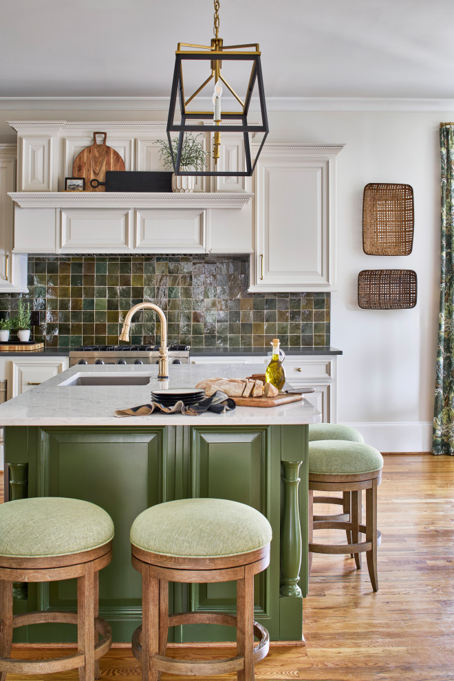 Example of a large transitional medium tone wood floor eat-in kitchen design in Atlanta with a single-bowl sink, raised-panel cabinets, white cabinets, quartz countertops, green backsplash, paneled appliances, an island and white countertops