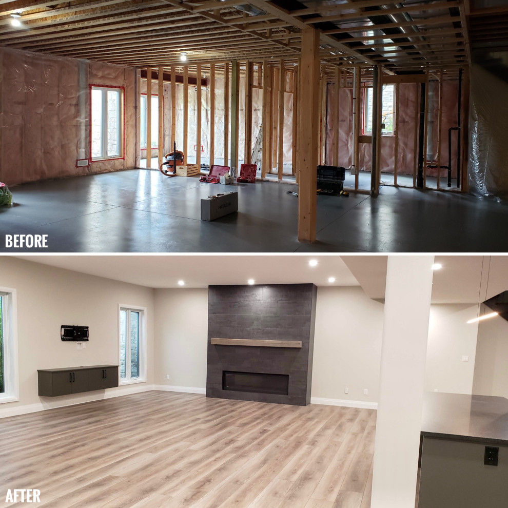 Example of a large transitional walk-out vinyl floor basement design with a bar and a tile fireplace