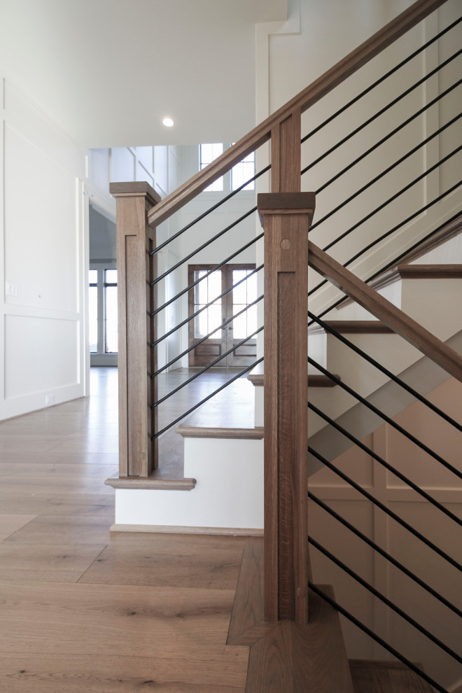 Foto de escalera suspendida retro grande con escalones de madera, contrahuellas de madera y barandilla de varios materiales