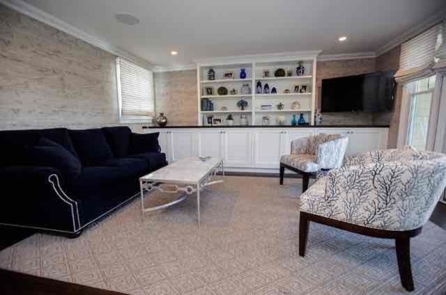 Photo of a beach style living room in New York with carpet.