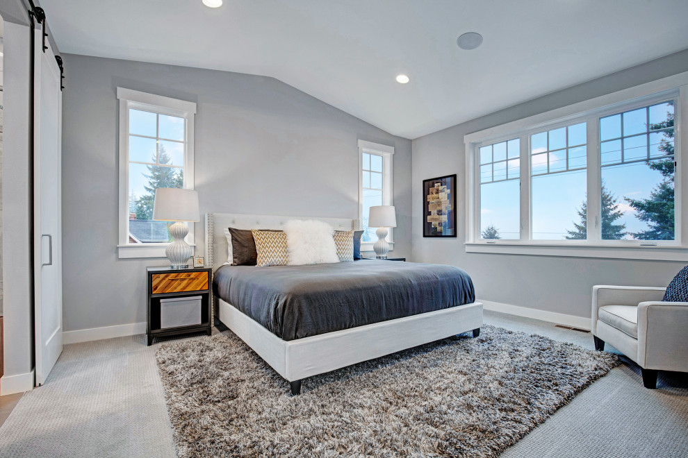 Photo of an arts and crafts master bedroom in Seattle with grey walls and carpet.