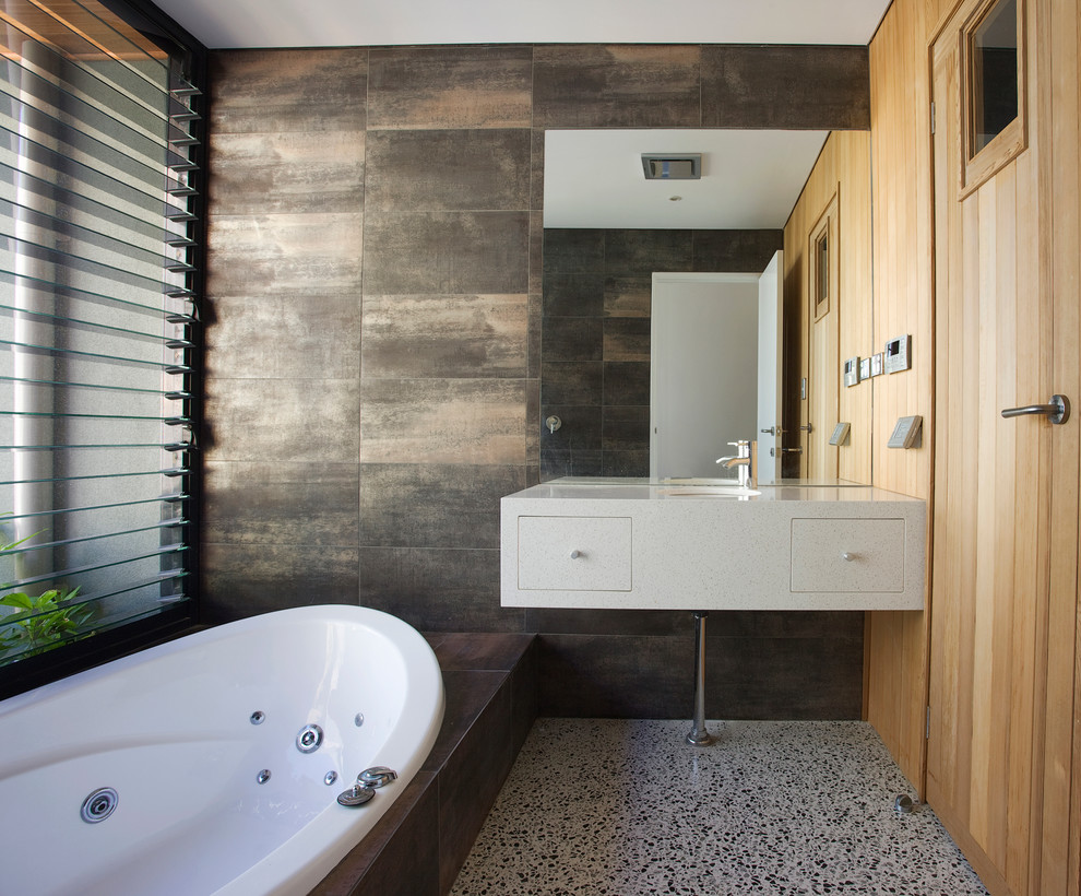 Photo of a contemporary bathroom in Perth with an undermount sink, a drop-in tub and brown tile.