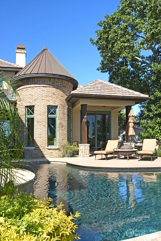 Inspiration for a rustic backyard concrete paver and kidney-shaped pool remodel