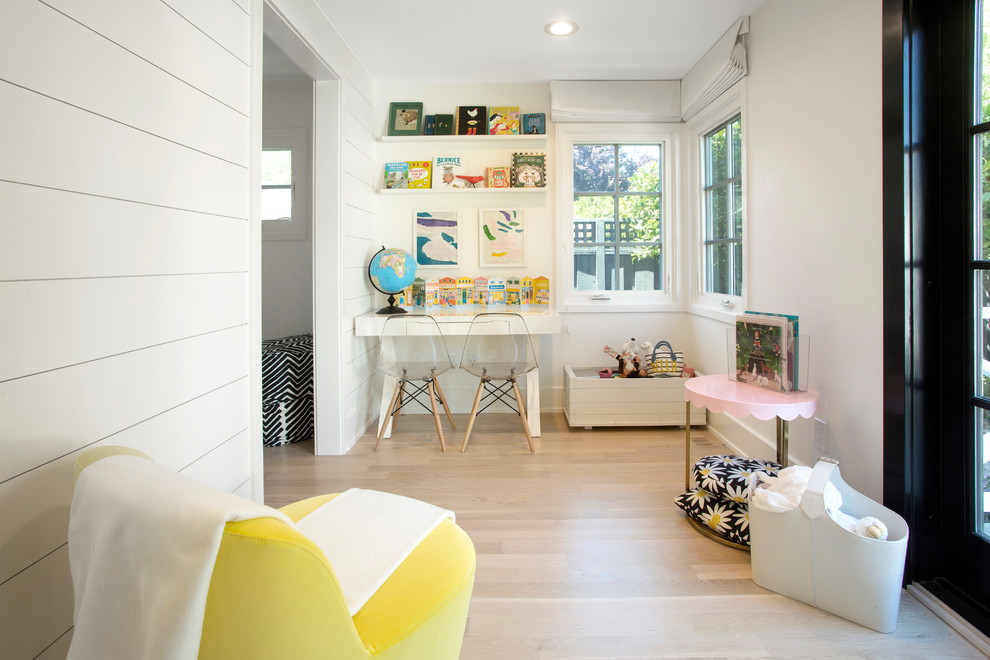 Design ideas for a transitional gender-neutral kids' study room for kids 4-10 years old in Other with white walls, light hardwood floors and beige floor.