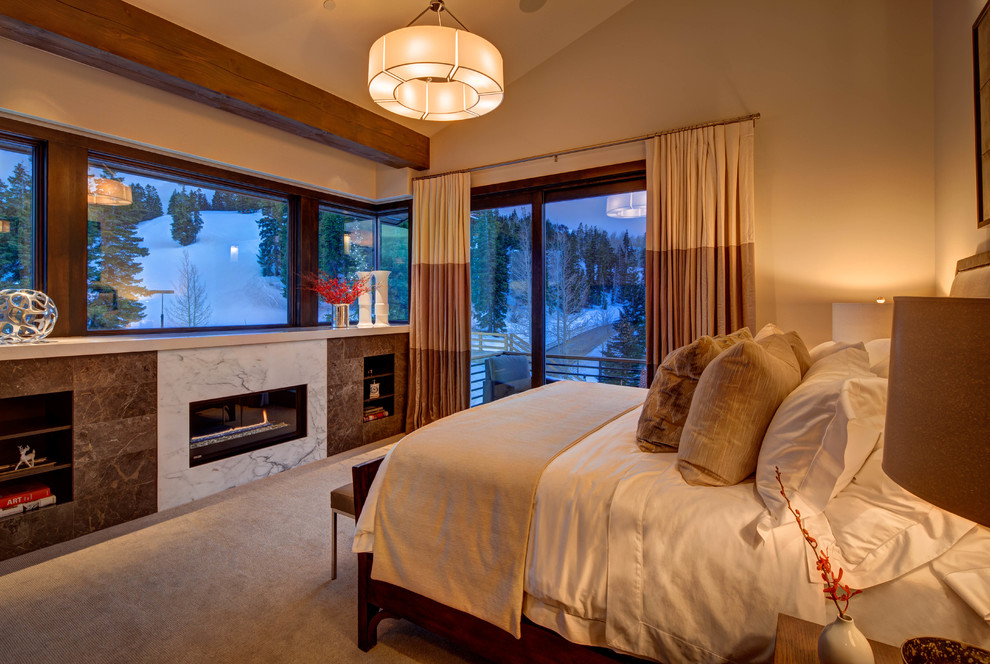 Inspiration for a large contemporary master bedroom in Salt Lake City with carpet and a ribbon fireplace.