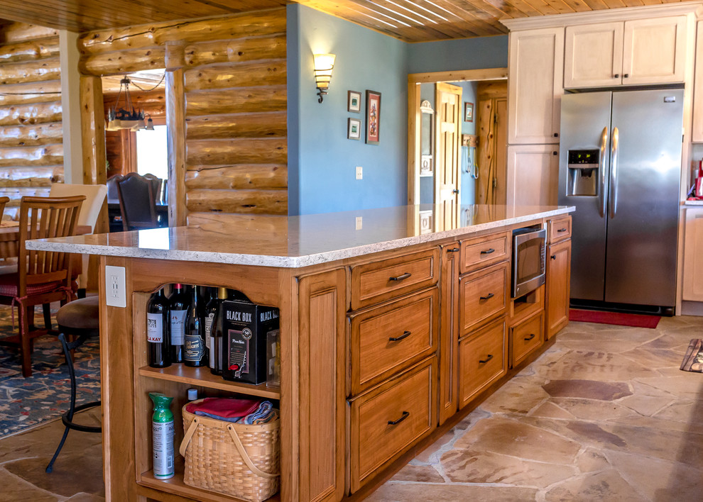 Mid-sized mountain style l-shaped beige floor enclosed kitchen photo in Denver with a farmhouse sink, medium tone wood cabinets, granite countertops, white backsplash, stainless steel appliances, an island and gray countertops